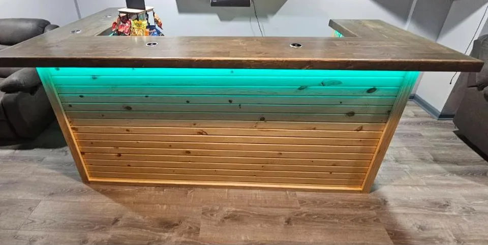 Straight stained pine bar with teal LED glow